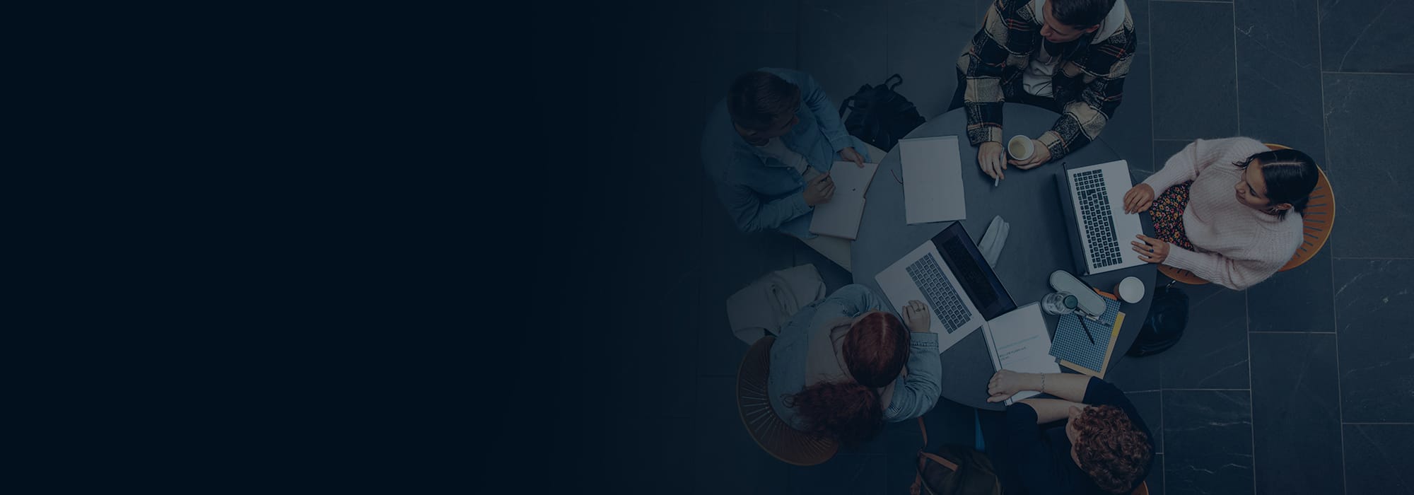 A team working together around a table, seen from above